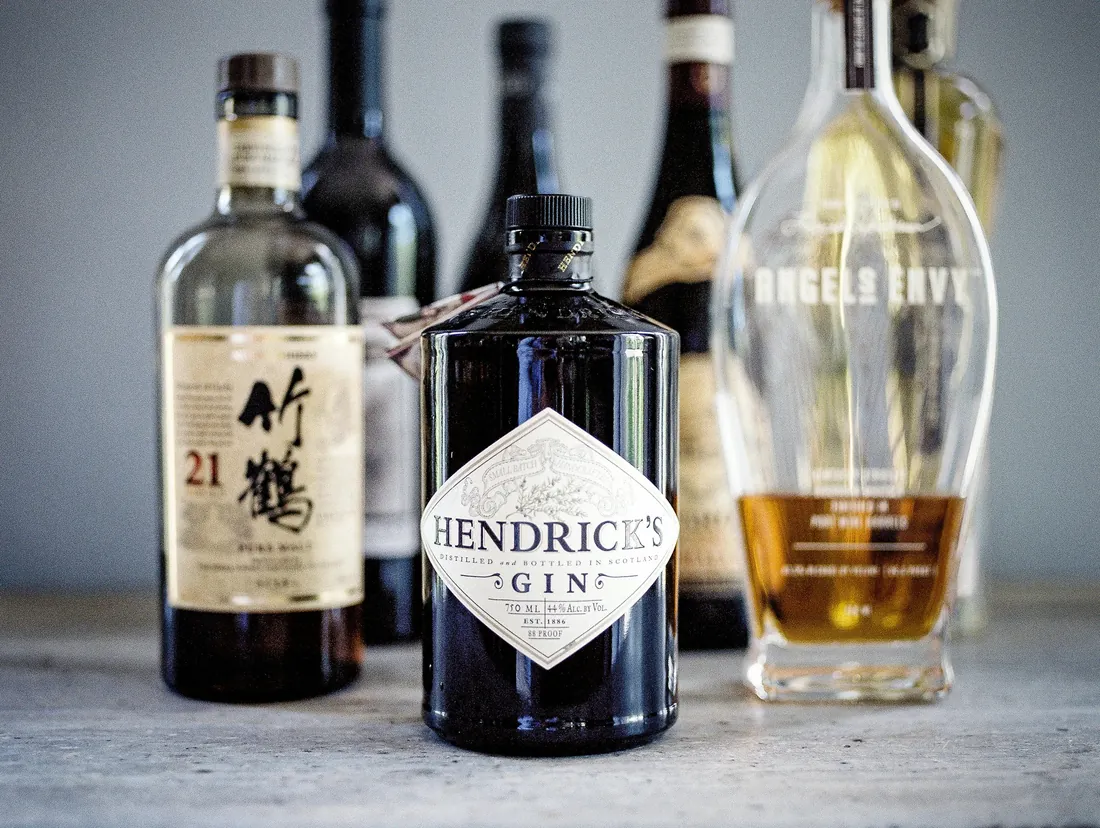 Film photograph of whiskey and gin bottles at a wedding bar