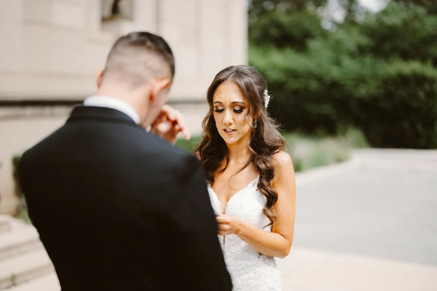 Chris wiping away a tear as Danielle looks down at the Rodin Museum in Philadelphia