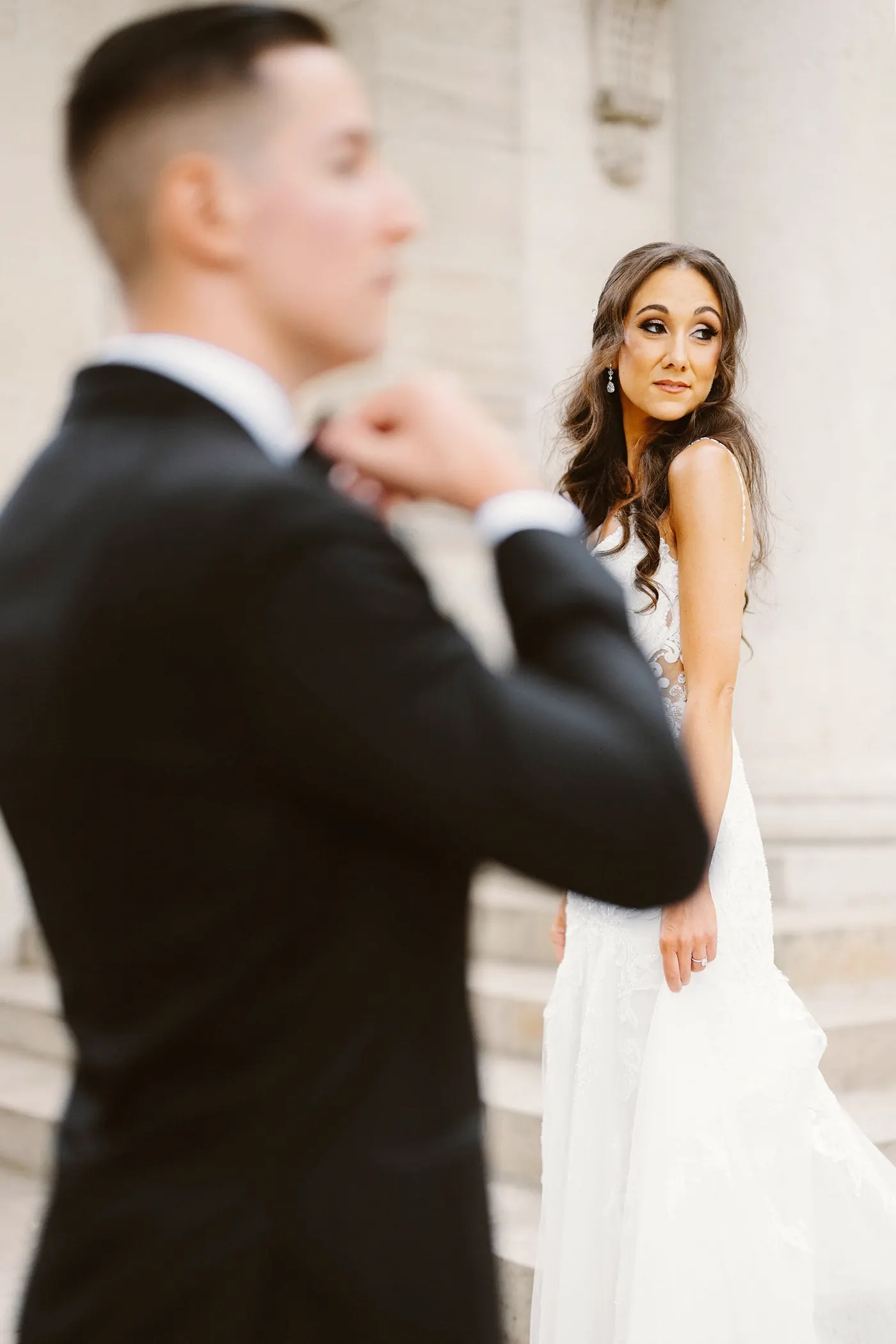 Danielle glancing toward Chris among the stone columns at the Rodin Museum in Philadelphia