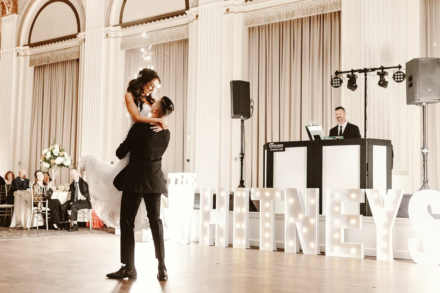 Chris lifting Danielle during their first dance at Cescaphe Ballroom at the Ben in Philadelphia