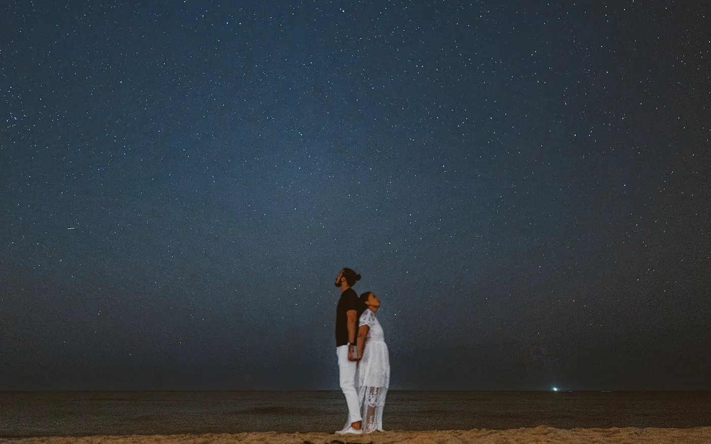 Dan and Madison stargazing on the beach at night near Barnegat Lighthouse on Long Beach Island, NJ