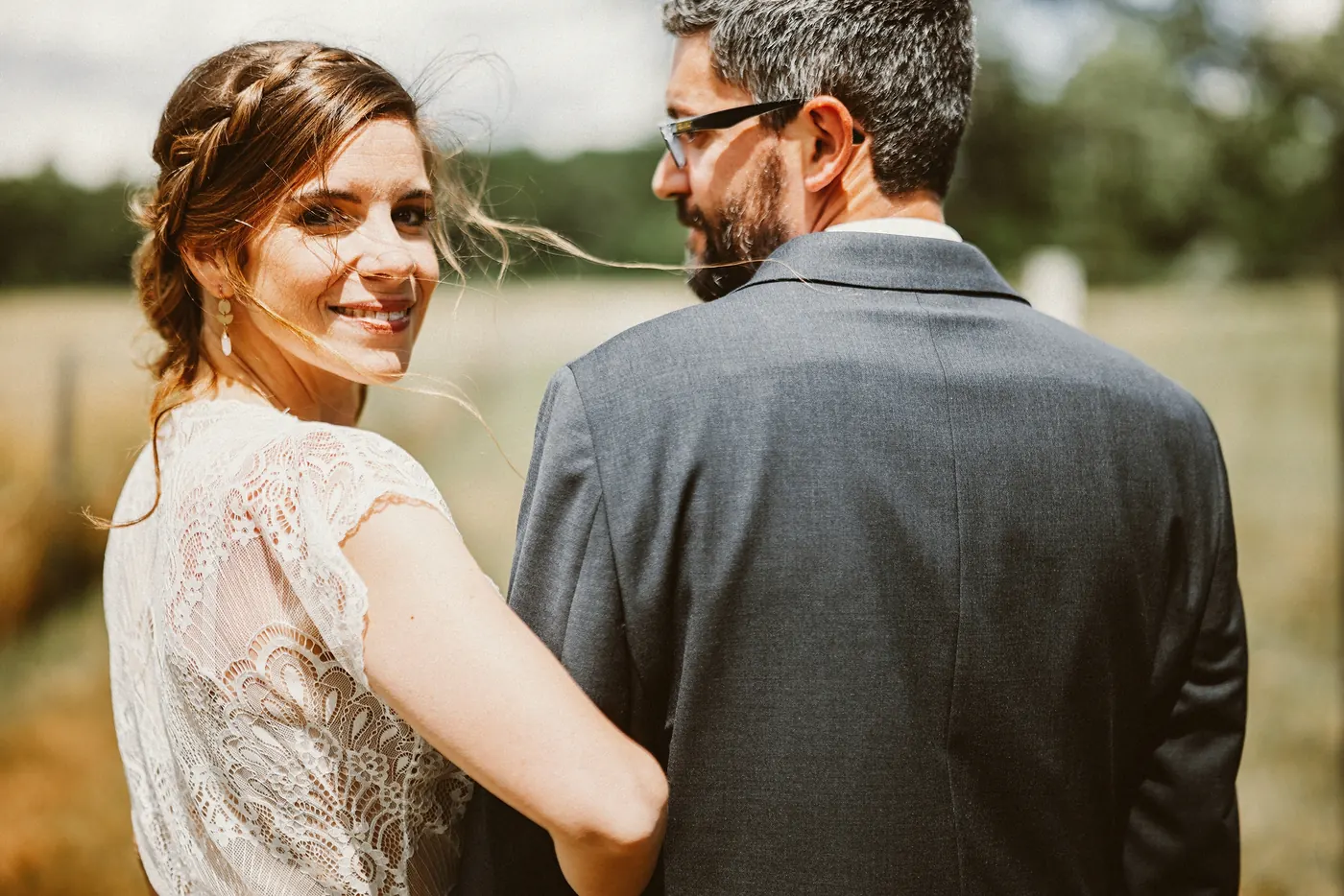 Erica looking back over her shoulder as she holds Matt at Johnson's Locust Hall Farm in Jobstown, NJ