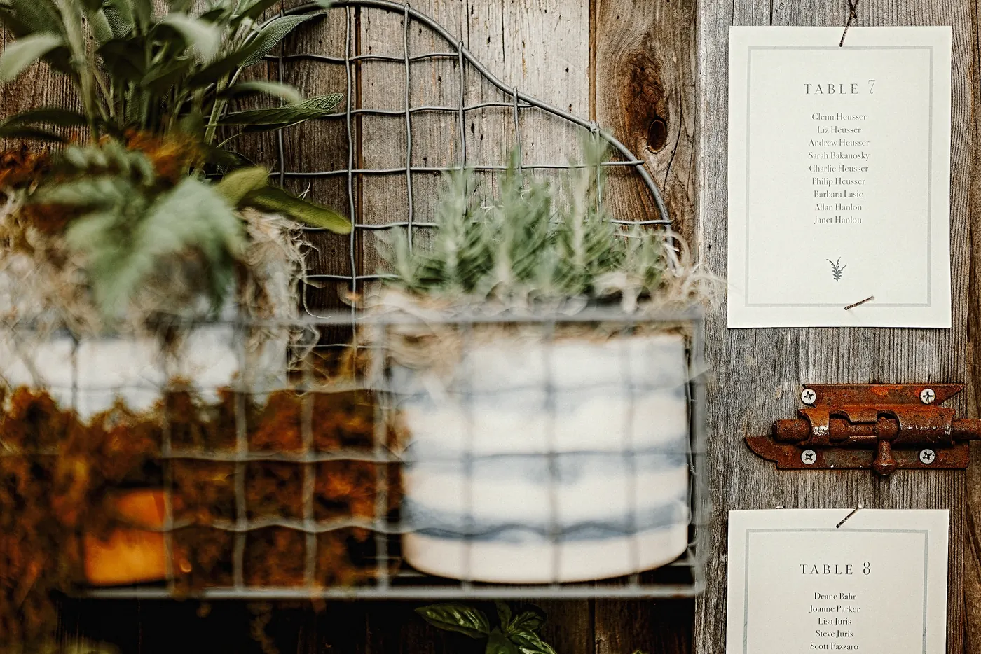 Table cards hanging on weathered wood with succulents at Johnson's Locust Hall Farm in Jobstown, NJ