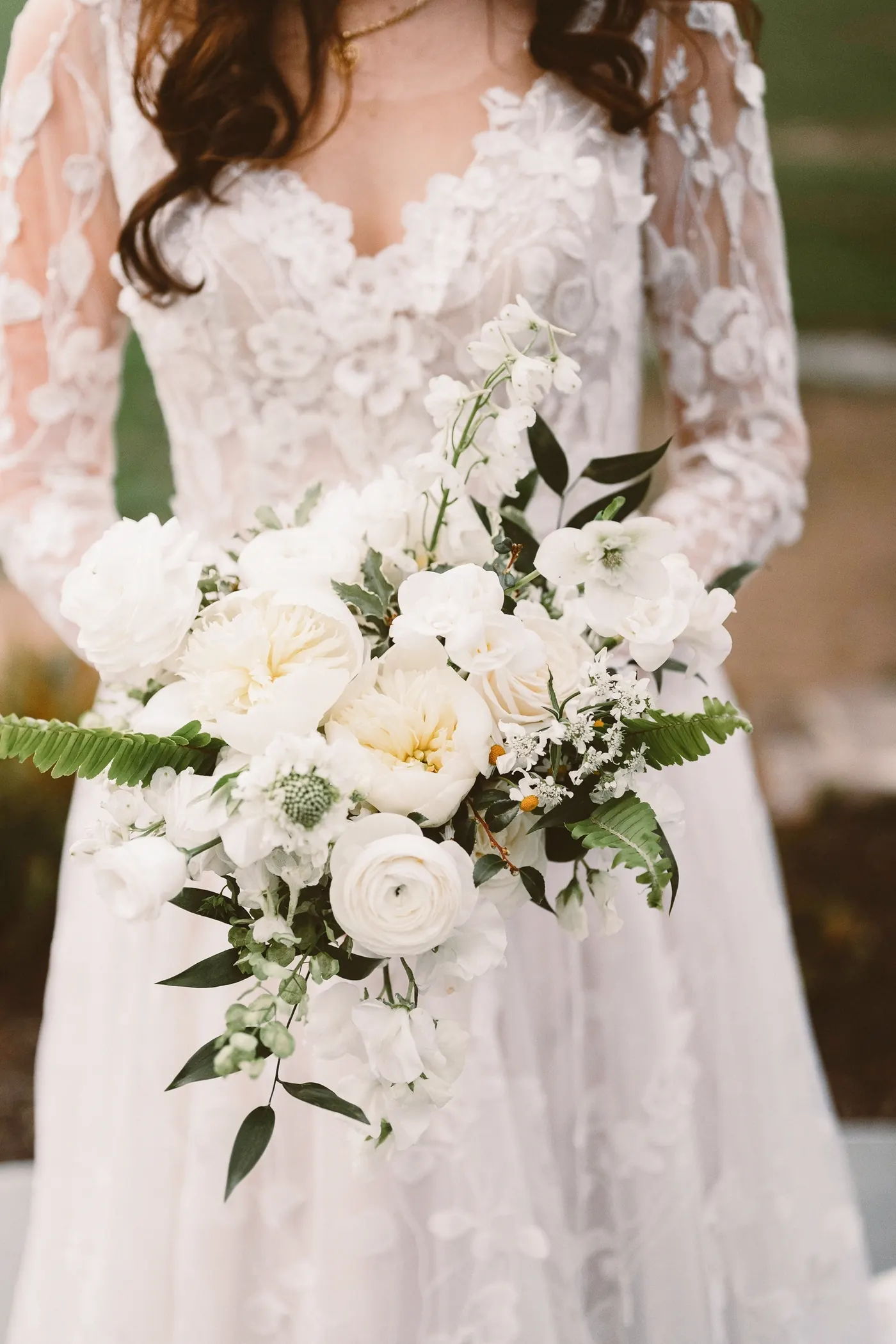 Maria's lace gown and white garden rose bouquet